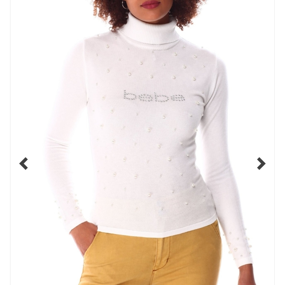The Bebe Rib Turtleneck Sweater by Bebe